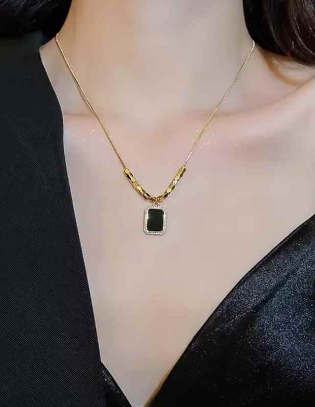 Black Pendant With Gold Beads buy now
