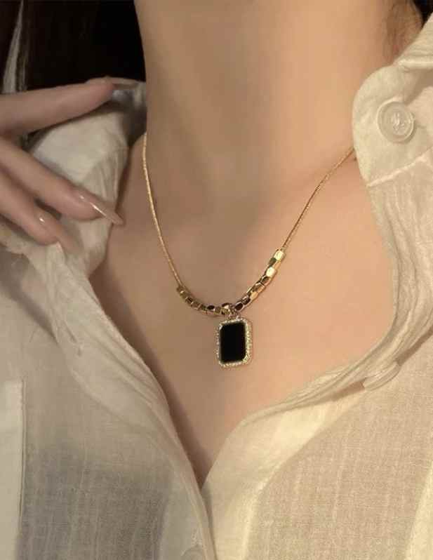 Black Pendant With Gold Beads